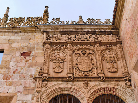 Salamanca Spain 29 November 2025 View of the intricate Plateresque facade of the University of Salamanca featuring detailed stone carvings and heraldic shields.