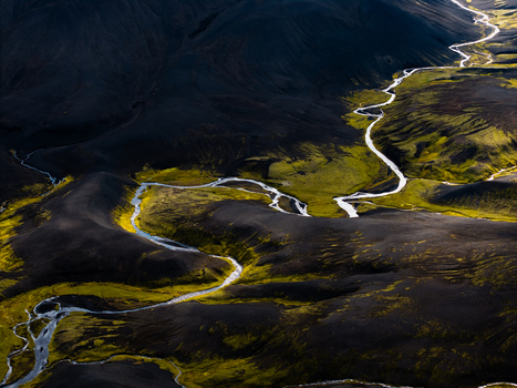 Aerial view of serpentine rivers carve through the stark volcanic landscape a mesmerizing dance of water and earth Landmannalaugar Iceland. Aerial view of serpentine rivers carve through the stark volcanic landscape a mesmerizing dance of water and earth Landmannalaugar Iceland.