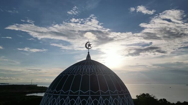 Aerial view of Masjid Raya Nur Ilahi dome at sunset Indonesia. Aerial view of Masjid Raya Nur Ilahi dome at sunset Indonesia.