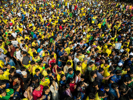 Dhaka Bangladesh 20 June 2026 Aerial view of a massive crowd of football fans wearing yellow jerseys gathered at Dhaka University Campus. Dhaka Bangladesh 20 June 2026 Aerial view of a massive crowd of football fans wearing yellow jerseys gathered at Dhaka University Campus.