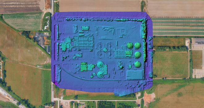 Aerial view of an industrial facility with circular tanks and processing structures rendered as a 3d model surrounded by agricultural fields in Richmond British Columbia Canada. Aerial view of an industrial facility with circular tanks and processing structures rendered as a 3d model surrounded by agricultural fields in Richmond British Columbia Canada.