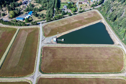 Aerial view of cranberry bogs with irrigation ponds and surrounding rural landscape in Bandon Oregon United States. Aerial view of cranberry bogs with irrigation ponds and surrounding rural landscape in Bandon Oregon United States.