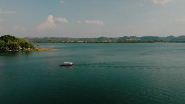 Aerial view of a boat on Lake Peten Itza near Flores Guatemala.