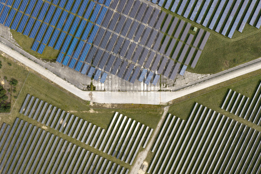 Aerial view of the solar field at the former military airfield in Preschen with rows of solar panels covering the historic runway and taxiway in Neisse Malxetal Brandenburg Germany. Aerial view of the solar field at the former military airfield in Preschen with rows of solar panels covering the historic runway and taxiway in Neisse Malxetal Brandenburg Germany.
