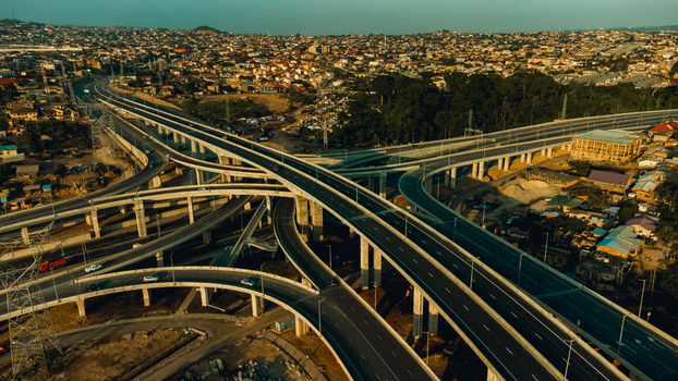 Aerial view of the Pokuase Interchange a multi level highway junction with concrete overpasses and ramps surrounded by urban development in Ga North Municipal Greater Accra Region Ghana. Aerial view of the Pokuase Interchange a multi level highway junction with concrete overpasses and ramps surrounded by urban development in Ga North Municipal Greater Accra Region Ghana.