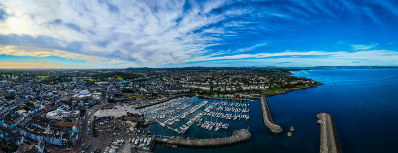 Aerial view of Bangor Harbour and Town featuring a marina filled with boats urban architecture and the coastline Bangor Northern Ireland United Kingdom.