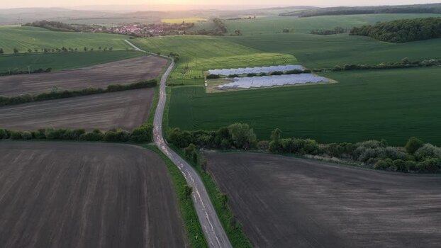 Aerial view of a solar farm and winding road Czechia. Aerial view of a solar farm and winding road Czechia.
