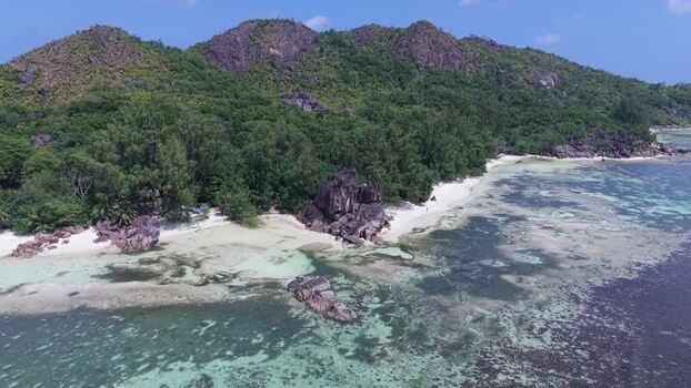 Aerial view of Curieuse Island with granite boulders Seychelles.