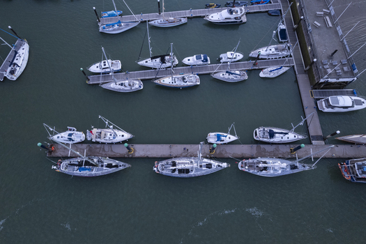 Aerial view of sailboats and motorboats moored at the marina in Cowes England United Kingdom.