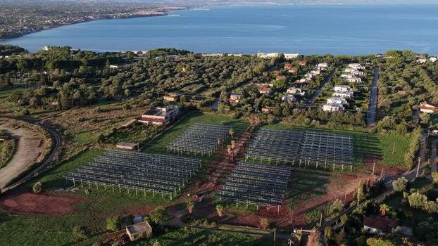 Aerial view of solar farm panels near the coast Italy.