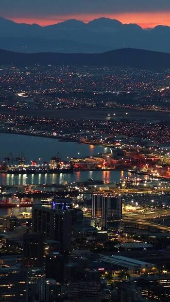 View of Cape Town city and harbor at twilight South Africa. View of Cape Town city and harbor at twilight South Africa.