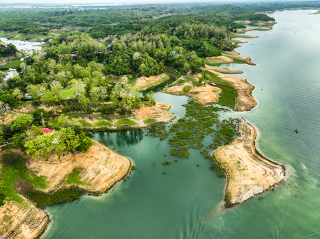 Rangamati Hill District Bangladesh 18 May 2024 Aerial view of Kaptai Lake with lush green hills winding shorelines and calm water.