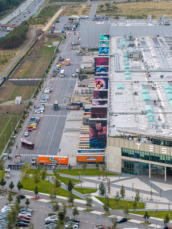 Grunheide Mark Brandenburg Germany 07 September 2026 Aerial view of Tesla Gigafactory Berlin Brandenburg with colorful murals parking lots and greenery. Grunheide Mark Brandenburg Germany 07 September 2026 Aerial view of Tesla Gigafactory Berlin Brandenburg with colorful murals parking lots and greenery.