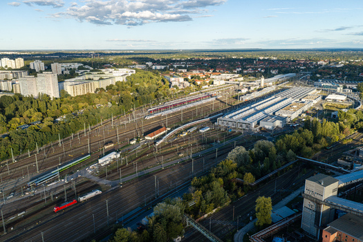 Berlin Germany 20 September 2026 Aerial view of ICE Werk Berlin Rummelsburg with multiple high speed trains parked on tracks maintenance halls and surrounding urban greenery. Berlin Germany 20 September 2026 Aerial view of ICE Werk Berlin Rummelsburg with multiple high speed trains parked on tracks maintenance halls and surrounding urban greenery.