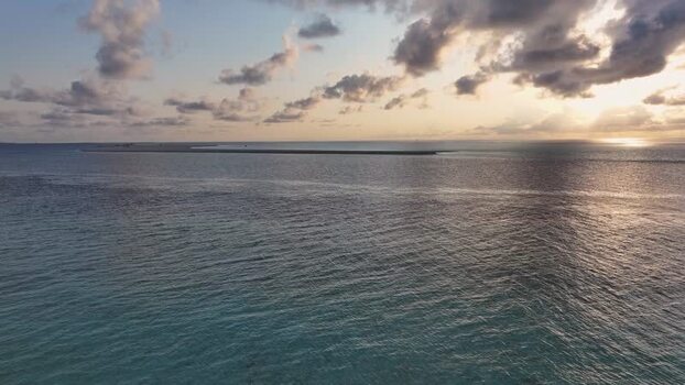 Aerial view of Gulhi island and sandbank at sunset Maldives. Aerial view of Gulhi island and sandbank at sunset Maldives.
