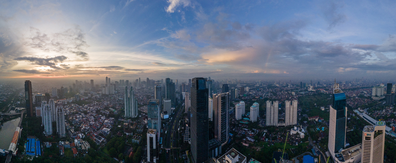 South Jakarta Indonesia 10 January 2026 Aerial view of Jakarta skyline featuring dense skyscrapers and residential buildings under a soft sunset sky. South Jakarta Indonesia 10 January 2026 Aerial view of Jakarta skyline featuring dense skyscrapers and residential buildings under a soft sunset sky.