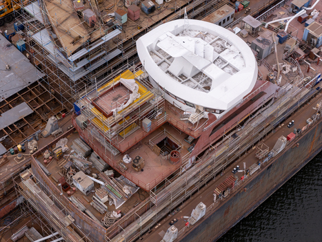 Aerial view of a ship under construction in a shipyard with scaffolding and metal structures in Gdansk Poland. Aerial view of a ship under construction in a shipyard with scaffolding and metal structures in Gdansk Poland.