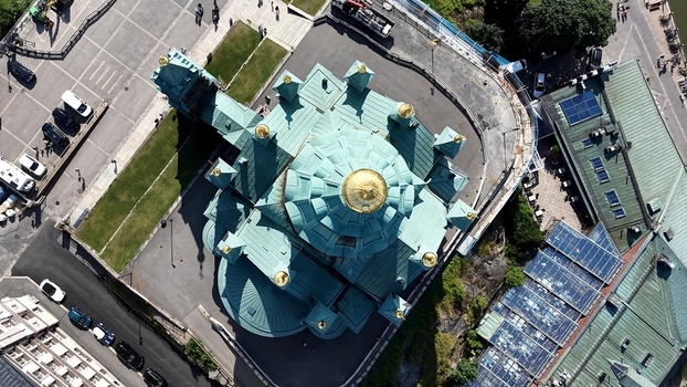 Aerial view of Uspenski Cathedral with its distinctive green roof and golden domes surrounded by urban streets and parked cars in Helsinki Uusimaa Finland. Aerial view of Uspenski Cathedral with its distinctive green roof and golden domes surrounded by urban streets and parked cars in Helsinki Uusimaa Finland.