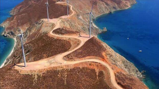 Aerial view of wind turbines on a coastal ridge Greece. Aerial view of wind turbines on a coastal ridge Greece.