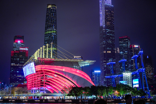 Guangzhou Guangdong Province China 22 February 2024 View of the illuminated Guangzhou Opera House at night with modern skyscrapers in the background. Guangzhou Guangdong Province China 22 February 2024 View of the illuminated Guangzhou Opera House at night with modern skyscrapers in the background.