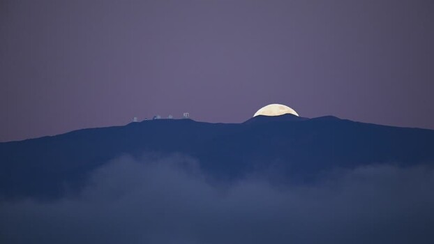 View of observatories on mountain with moon United States. View of observatories on mountain with moon United States.