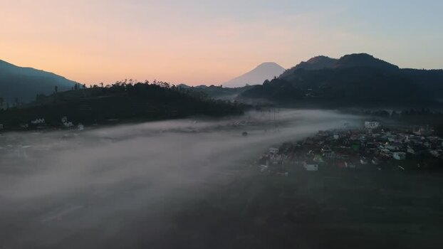 Aerial view of Dieng Plateau shrouded in morning mist Indonesia. Aerial view of Dieng Plateau shrouded in morning mist Indonesia.