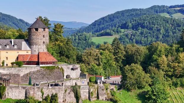 Aerial view of Burg Deutschlandsberg castle and hills Austria.