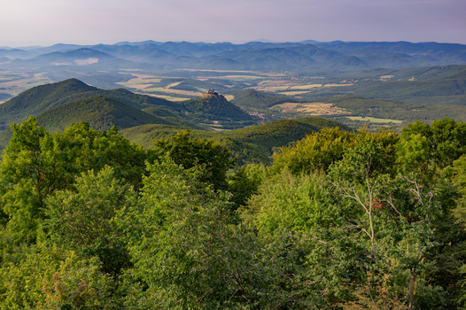 Aerial view of Fuzer Castle perched on a volcanic hill surrounded by dense green forests and rolling mountains in Fuzer Borsod Abauj Zemplen Hungary. Aerial view of Fuzer Castle perched on a volcanic hill surrounded by dense green forests and rolling mountains in Fuzer Borsod Abauj Zemplen Hungary.