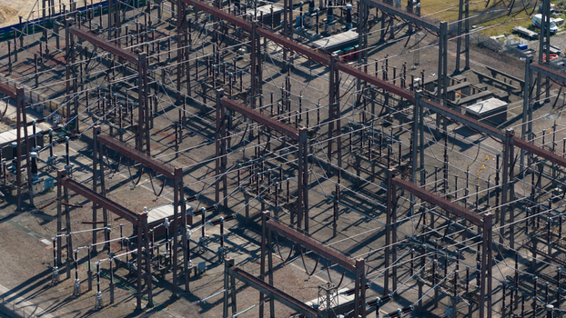 Aerial view of Pelham Storage Limited electrical substation featuring complex metal structures high voltage equipment and power lines in Bishop s Stortford England United Kingdom. Aerial view of Pelham Storage Limited electrical substation featuring complex metal structures high voltage equipment and power lines in Bishop s Stortford England United Kingdom.