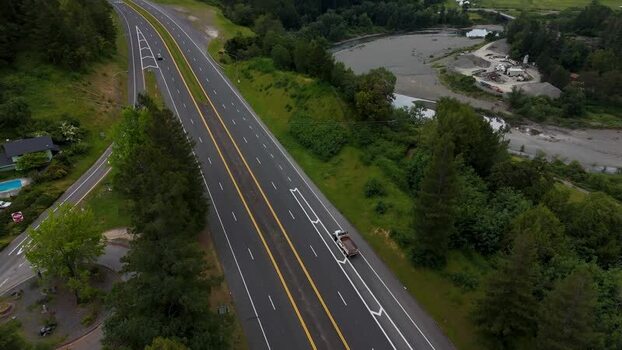 Aerial view of a highway through lush forests United States. Aerial view of a highway through lush forests United States.