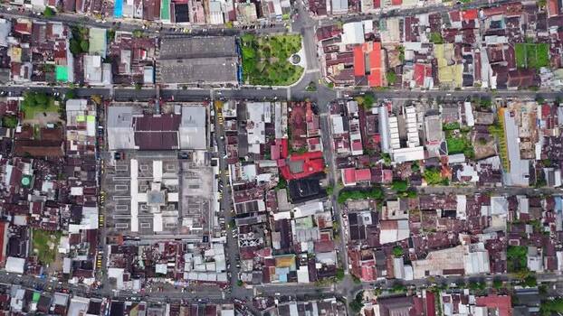 Aerial view of dense urban rooftops and streets in Kejajar Indonesia. Aerial view of dense urban rooftops and streets in Kejajar Indonesia.