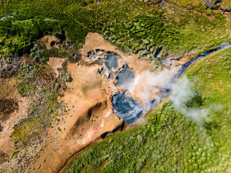 Aerial view of the geothermal pools and steam vents in the volcanic landscape of Grensdalur Sveitarfelagid Olfus Iceland. Aerial view of the geothermal pools and steam vents in the volcanic landscape of Grensdalur Sveitarfelagid Olfus Iceland.