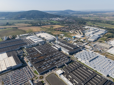 Aerial view of the Volkswagen plant near Devinska Nova Ves with industrial buildings parking lots and green hills in Bratislava Bratislavsky kraj Slovakia. Aerial view of the Volkswagen plant near Devinska Nova Ves with industrial buildings parking lots and green hills in Bratislava Bratislavsky kraj Slovakia.