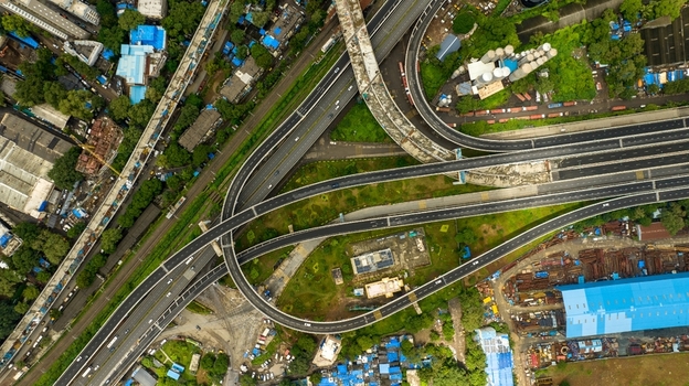 Aerial view of the Atal Bihari Vajpayee Sewri Nhava Sheva Atal Setu a complex highway interchange with multi level flyovers and surrounding industrial structures in Mumbai Maharashtra India. Aerial view of the Atal Bihari Vajpayee Sewri Nhava Sheva Atal Setu a complex highway interchange with multi level flyovers and surrounding industrial structures in Mumbai Maharashtra India.