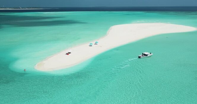 Aerial view of a white sandbank and boat in turquoise water Maldives. Aerial view of a white sandbank and boat in turquoise water Maldives.