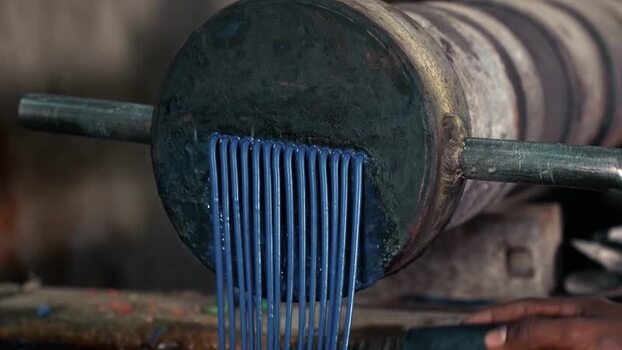View of blue plastic extrusion process in Bangladesh. View of blue plastic extrusion process in Bangladesh.