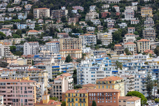 Aerial view of Nice featuring colorful Mediterranean buildings terracotta rooftops and hillside residential architecture in Nice Provence Alpes Cote d Azur France. Aerial view of Nice featuring colorful Mediterranean buildings terracotta rooftops and hillside residential architecture in Nice Provence Alpes Cote d Azur France.