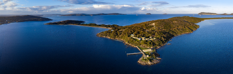Aerial view of Camp Quaranup featuring historic buildings and a jetty surrounded by deep blue waters at Vancouver Peninsula Western Australia Australia. Aerial view of Camp Quaranup featuring historic buildings and a jetty surrounded by deep blue waters at Vancouver Peninsula Western Australia Australia.