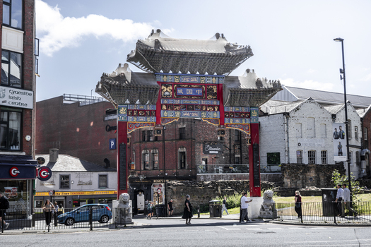 Newcastle upon Tyne United Kingdom 13 July 2026 View of the ornate Chinese arch in Chinatown featuring traditional red and gold details stone lion statues and historic brick buildings. Newcastle upon Tyne United Kingdom 13 July 2026 View of the ornate Chinese arch in Chinatown featuring traditional red and gold details stone lion statues and historic brick buildings.