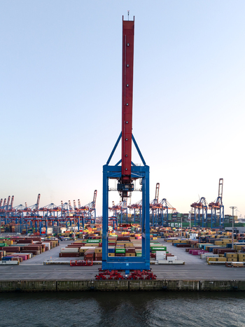 Hamburg Germany 09 March 2026 Aerial view of HHLA Container Terminal Burchardkai CTB featuring a massive blue and red gantry crane overlooking rows of shipping containers at the Port of Hamburg. Hamburg Germany 09 March 2026 Aerial view of HHLA Container Terminal Burchardkai CTB featuring a massive blue and red gantry crane overlooking rows of shipping containers at the Port of Hamburg.