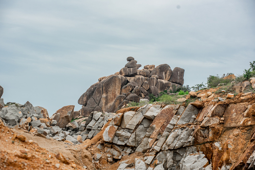 View of the rugged granite rock formations and rocky landscape under a cloudy sky in Jos North Plateau Nigeria. View of the rugged granite rock formations and rocky landscape under a cloudy sky in Jos North Plateau Nigeria.