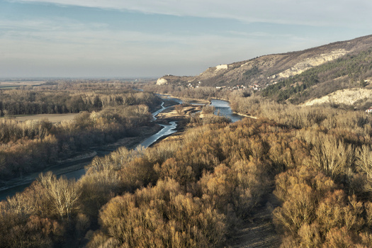 View of Devin Castle ruins perched on a rocky cliff overlooking the winding river and dense forest during winter Bratislava IV Bratislava Region Slovakia. View of Devin Castle ruins perched on a rocky cliff overlooking the winding river and dense forest during winter Bratislava IV Bratislava Region Slovakia.
