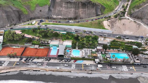 Aerial view of tennis courts swimming pools and a coastal highway along the cliffs in Barranco Provincia de Lima Peru. Aerial view of tennis courts swimming pools and a coastal highway along the cliffs in Barranco Provincia de Lima Peru.