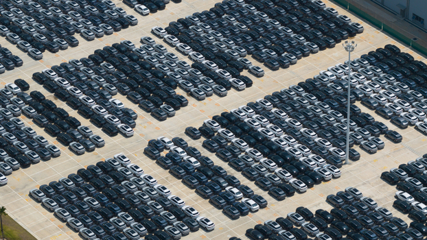 Aerial view of rows of new electric vehicles parked at the BYD AUTO THAILAND CO. LTD. facility in Phananikhom Rayong Thailand.