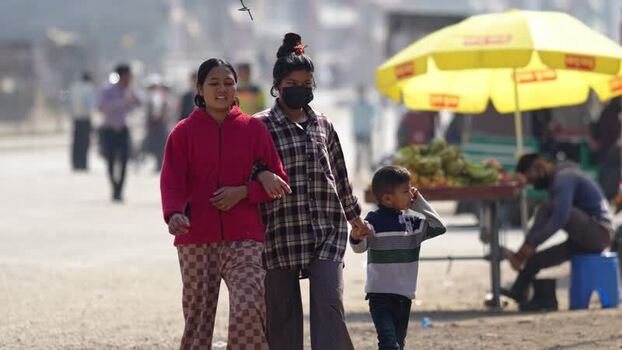 View of people walking on a street in Dhangadhi Nepal. View of people walking on a street in Dhangadhi Nepal.