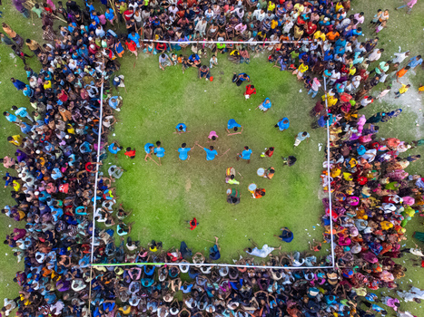 Nilphamari Bangladesh 01 May 2026 Aerial view of a large crowd of people gathered around a square grassy field during a traditional sports event. Nilphamari Bangladesh 01 May 2026 Aerial view of a large crowd of people gathered around a square grassy field during a traditional sports event.