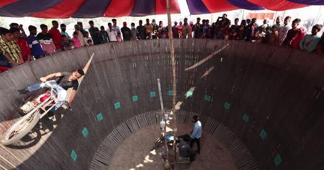 View of a motorcycle stuntman in the Well of Death Bangladesh.