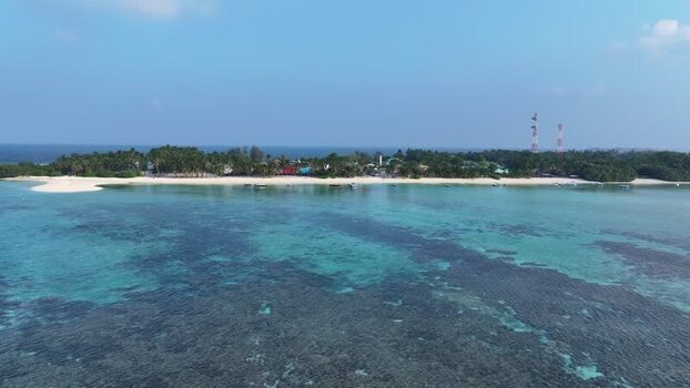 Aerial view of Naavaidhoo island and coral reefs Maldives. Aerial view of Naavaidhoo island and coral reefs Maldives.