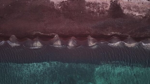 Aerial view of Red beach with turquoise water Greece.