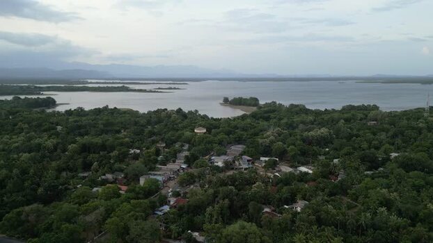 Aerial view of a lake surrounded by lush greenery Sri Lanka.